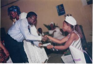 Fatherless Graduate Receiving Her Certificate of Training.